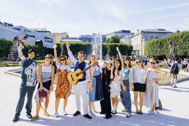 Group of travelers enjoying the Private Sound of Maria Tour with Live Music in Salzburg’s Mirabell Gardens