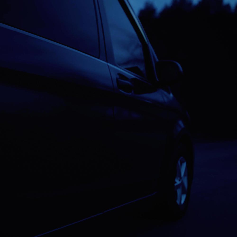 Deep-blue abstract vehicle detail representing the weTours brand protection feature image.