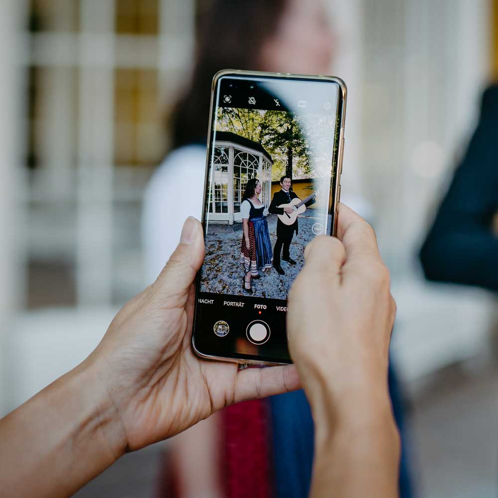 Guest photographing a live performance during a private tour in Salzburg