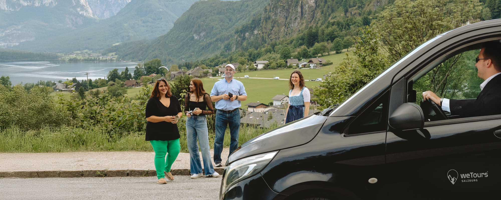Luxury Tourism Salzburg – Salzkammergut Lake Experience Luxury tourism Salzburg – guests enjoying a private guided experience overlooking the Salzkammergut Lake District with a weTours minivan.