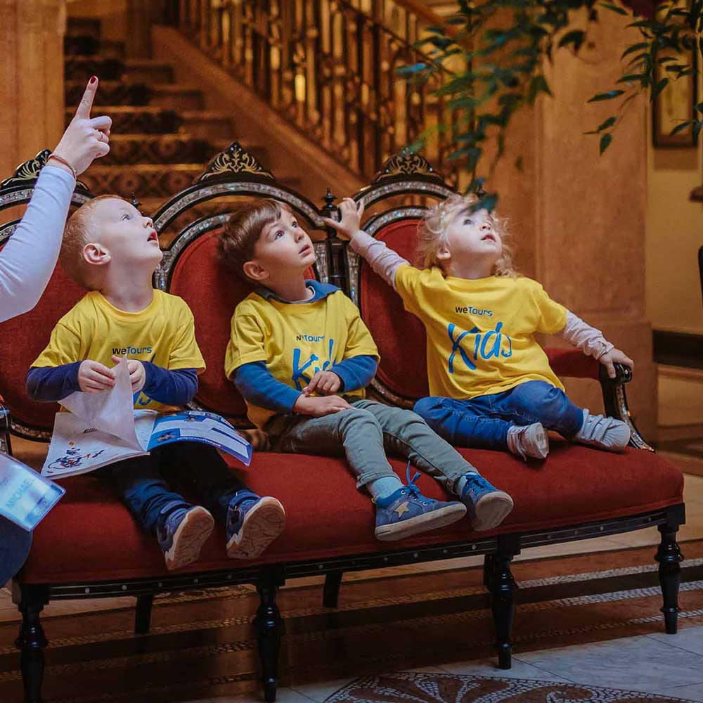 Children discovering Salzburg during a weTours Kids experience inside Hotel Sacher.