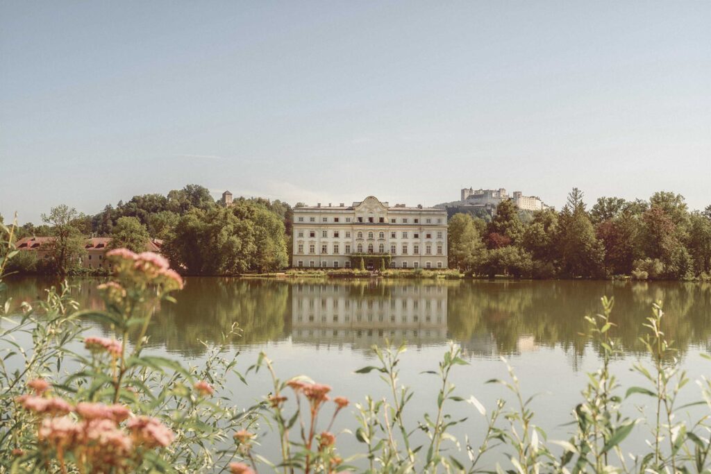 Sound of Music Tour Salzburg and Lake District at Schloss Leopoldskron with lakeside palace view