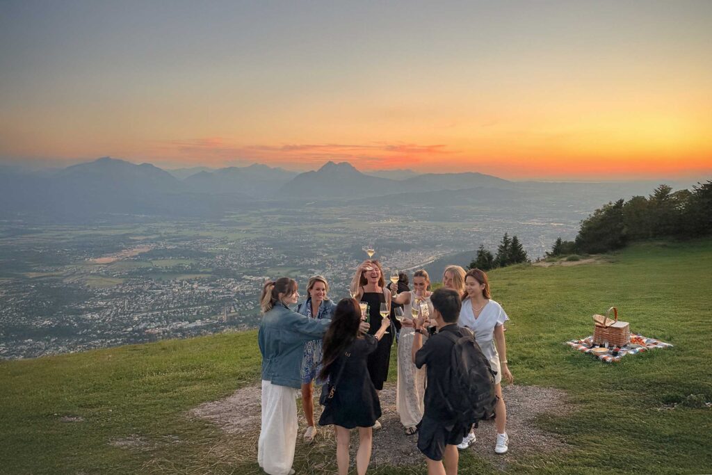 Guests toasting during the Salzburg Sunset Tour at the Gaisberg viewpoint