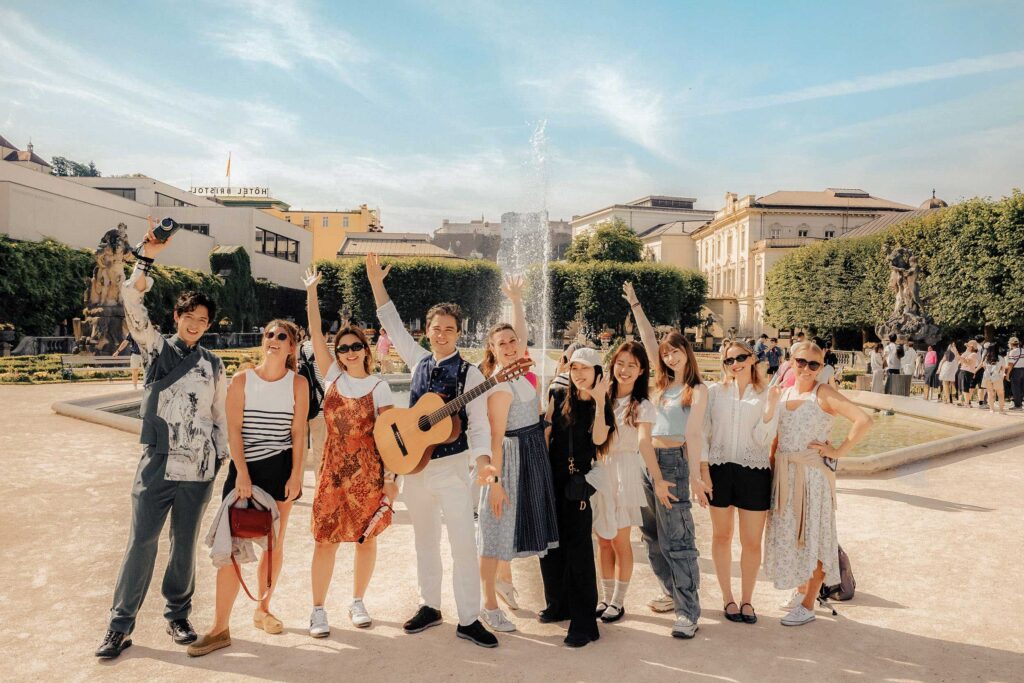 Group enjoying a joyful moment during the Sound of Music Tour Salzburg in the historic city center