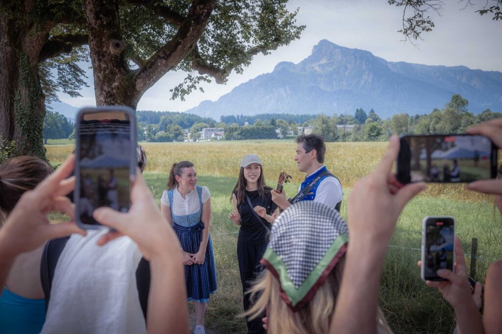 Live singing experience in Hellbrunn alley near the Trapp Villa, Sound of Music–inspired performance in a scenic alpine setting