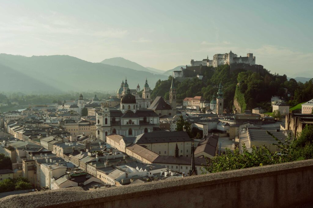Salzburg city view from Mönchsberg viewpoint with Hohensalzburg Fortress, a Sound of Music filming location featured in Maria’s Walking Tour and the Ultimate Experience