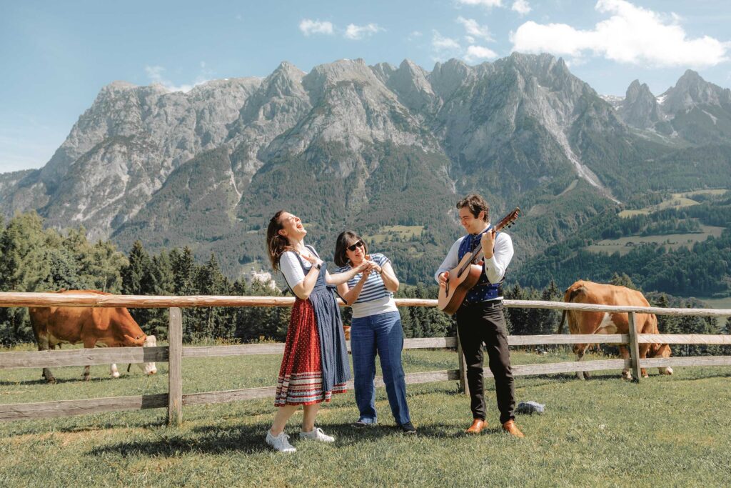 Sound of Music meadow in Werfen with live music and guests enjoying an alpine experience during the Private Sound of Maria Tour City & Meadow Escape and Ultimate Experience