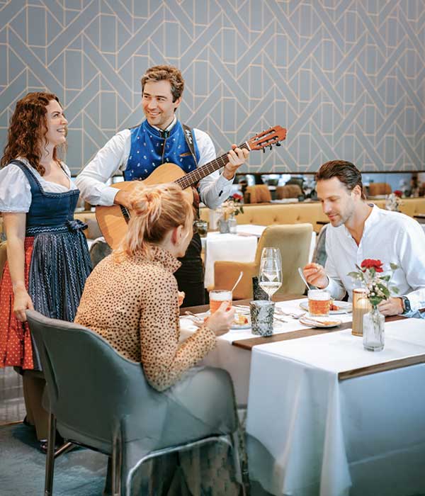 Guests enjoying the Sound of Salzburg Menu with live traditional music during an exclusive private dining experience in Salzburg.