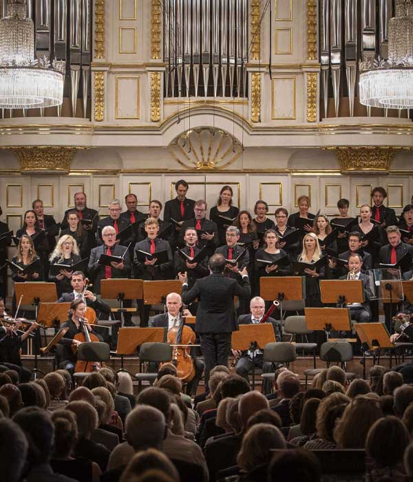 Orchestra and choir performing classical music in a historic Salzburg concert hall