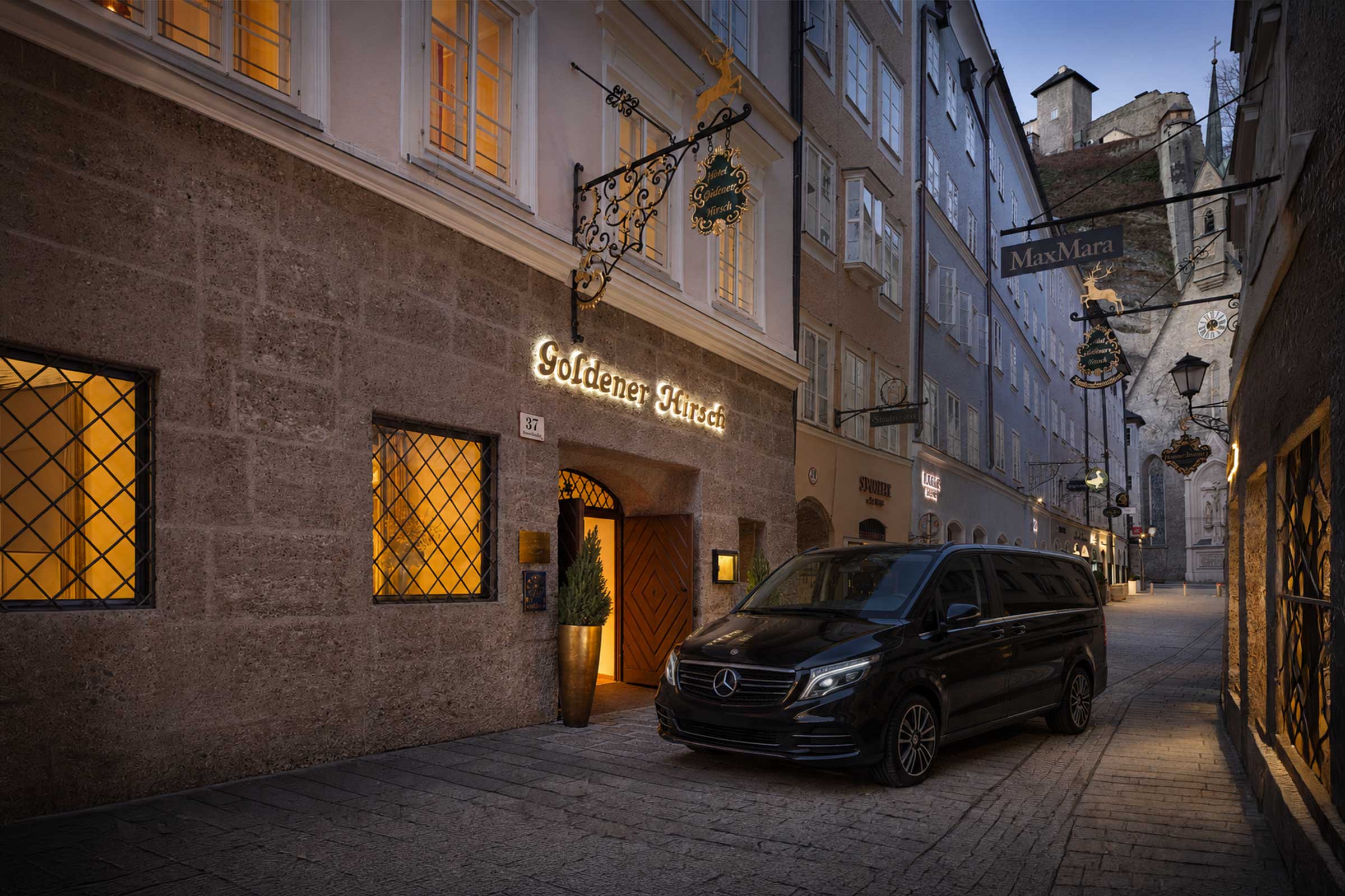 Private experiences from Hotel Goldener Hirsch Salzburg with black Mercedes minivan